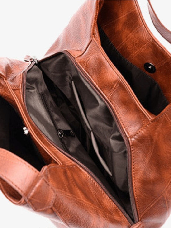 Bolso de mano de cuero<br>Amaya